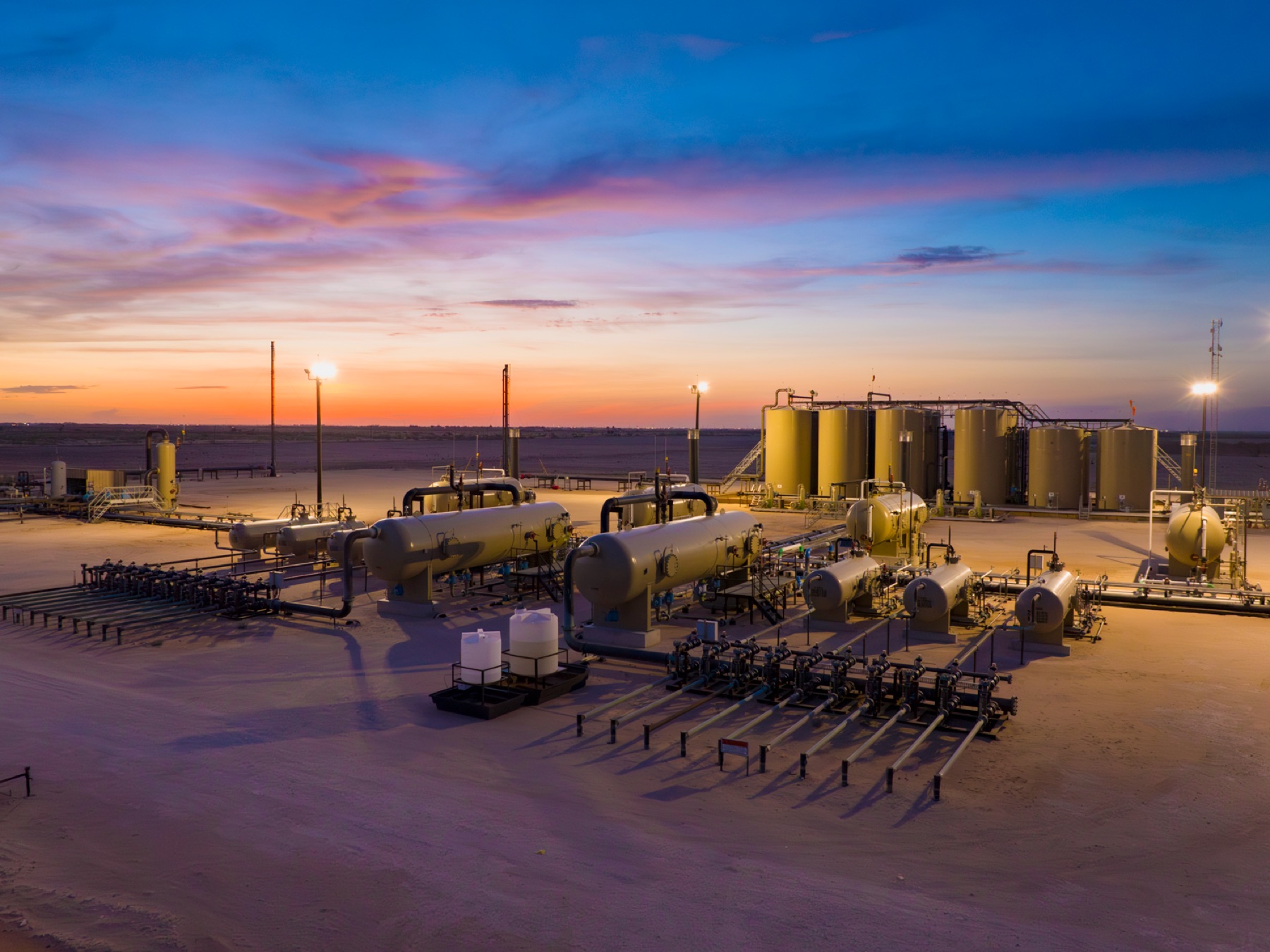 Tank Battery At Sunset